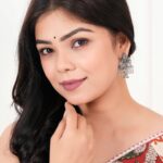 Women’s silver Indo-Western drop earrings with matching necklace, fashion artificial jewellery, perfect for festive, wedding, and party occasions in India.