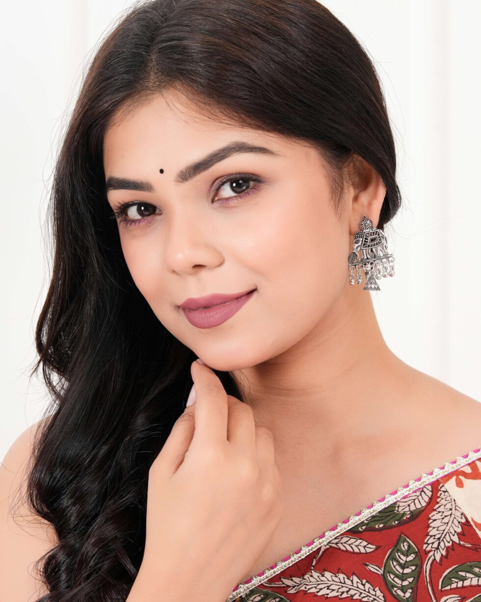 Women’s silver Indo-Western drop earrings with matching necklace, fashion artificial jewellery, perfect for festive, wedding, and party occasions in India.